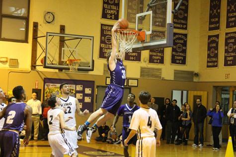 Senior Mike Jurzynski slams home a dunk to seal the win for the Panthers.  Watch the video filmed by Rajan Cutting: https://www.youtube.com/watch?v=hJxjzFA1lRg&feature=youtu.be