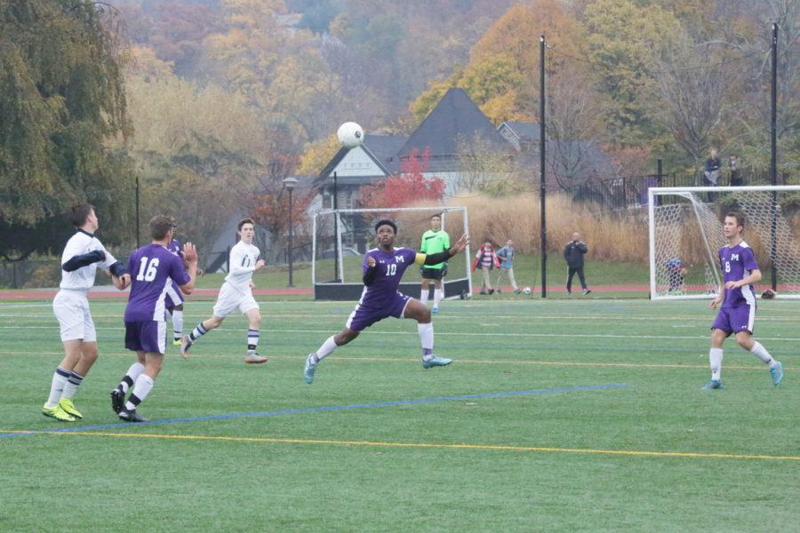 Senior Raji Ahamad gathers the ball in an attempt to start an offensive attack. Masters won the semi-final game 3-2, with an impressive comeback, against Rye Country Day School. 