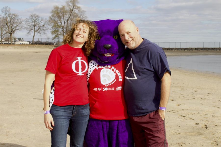 Anna Cabral and Ed Gormley posing with the Panther at the Polar Plunge.
