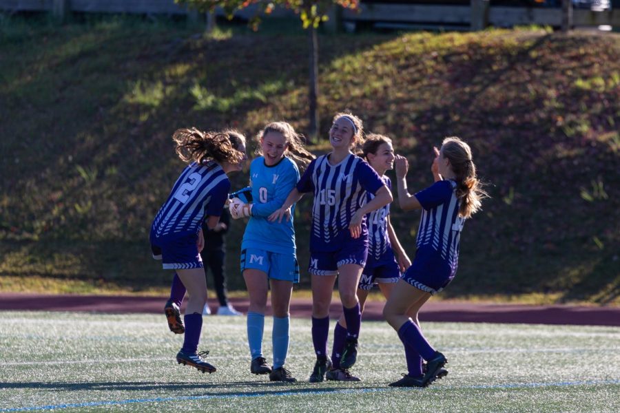 Girls Varsity Soccer celebrates a 2-1 victory over Convent of the Sacred Heart on Oct. 5. Pictured from left to right are Lauren Marlowe (23), Francesca Mann (21), Kwynne Schlossman (22),  Rachel Schwartz (21) and Tara Phillips (23). The team has more wins this year than theyve had in any season since 2009.