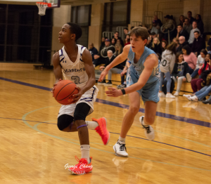 Freshman Stephon Marbury drives into the paint in a game against Columbia Prep.