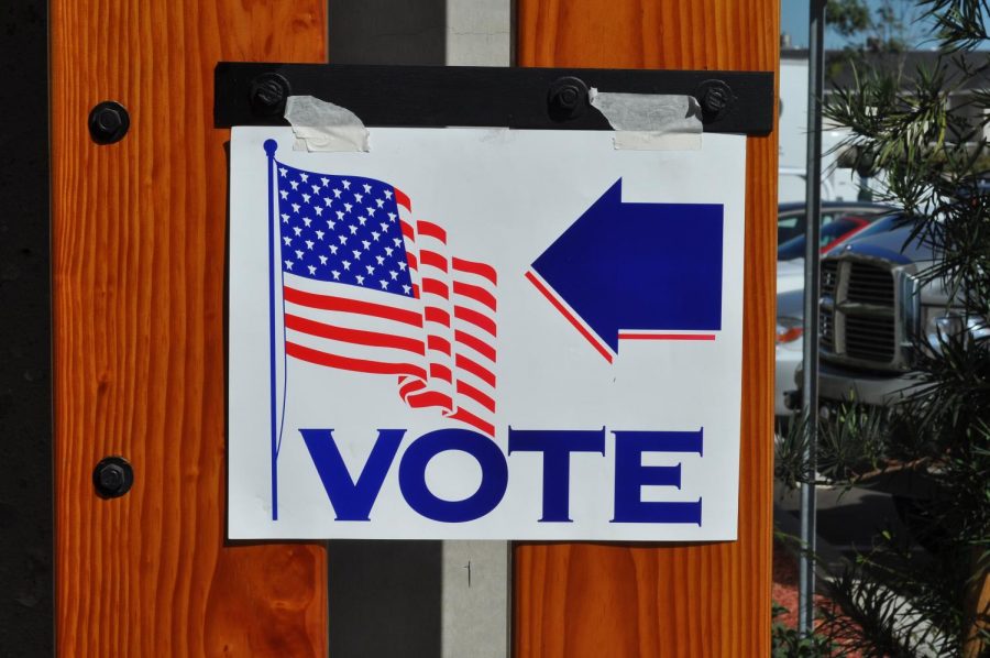 A sign points to a voting location. Primary elections in New York will take place on June 23. Voters have the option of going to polling locations, or sending in an absentee ballot, in order to better socially distance.