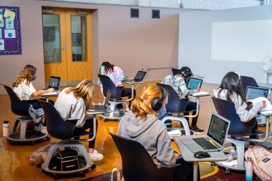 Middle School students sit in a recently constructed classroom in Strayer Hall. Remodeling spaces, such as Strayer and Doc Wilson Hall, was a major expense in bringing students and teachers back to school safely for in-person learning last fall. 