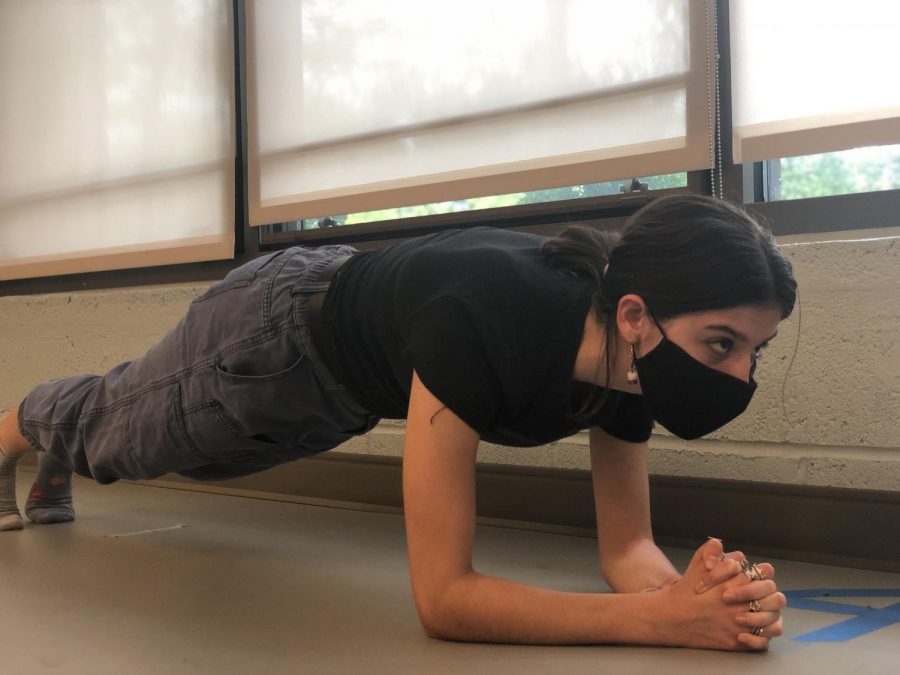 Sophomore Amelia von Jan planks as part of her asynchronous PE credit. This year, many students has resorted to the new elective to obtain their sports credit.   