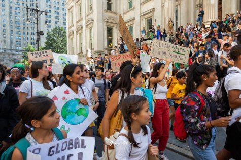 People protesting during the September 2019 climate strikes in New

York City. The protested had an estimated turnout of over 250,000. Mas-
ters students were allowed an excused absence to go to the march.