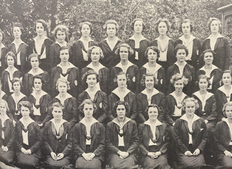 1935: The class of 1935. During this time, the values of modesty and uniformity guided the dress code choice. Note how every students hands are clasped identically. 