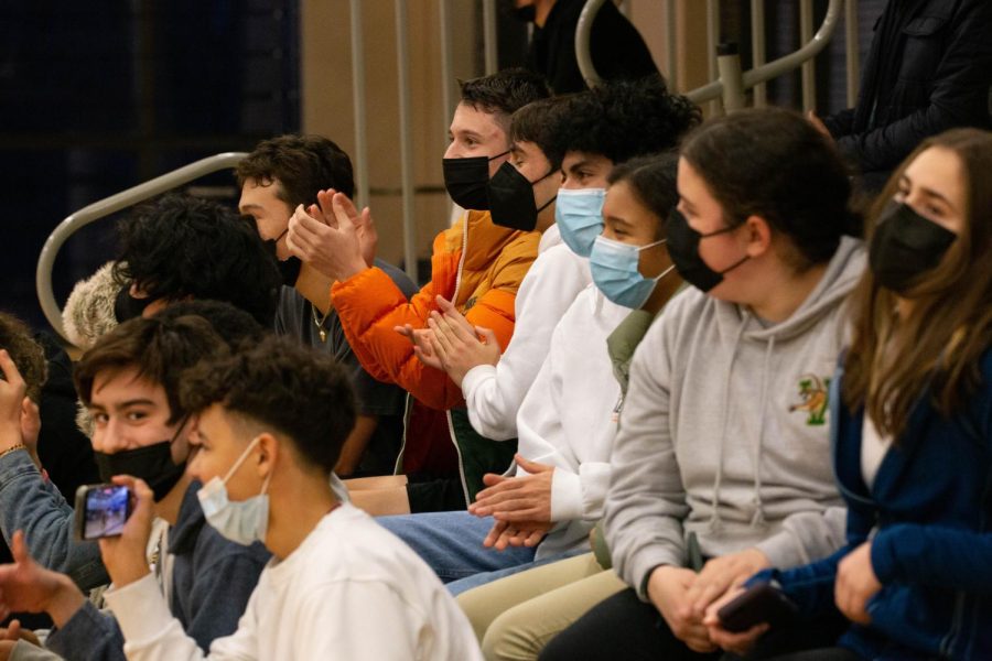 Fans cheer on the boys junior varsity two basketball team in a game against Greenwich Country Day on Tuesday, Feb. 8. The team ended up losing by a score of 33-22.