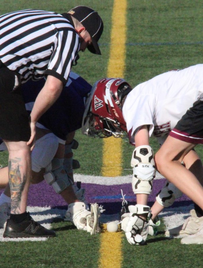 #22 Nathan Lothian ‘24 takes a faceoff against Wooster at Masters home Greene field. Lothian is one of the team’s go-to faceoff takers and has been highly successful so far this season.