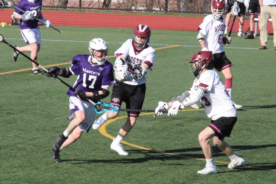 Jack Parsons ’24 draws in two Wooster defenders as he takes the ball upfield. Parsons is known for using his lengthy build to maneuver around with the ball and have a long reach on defense.