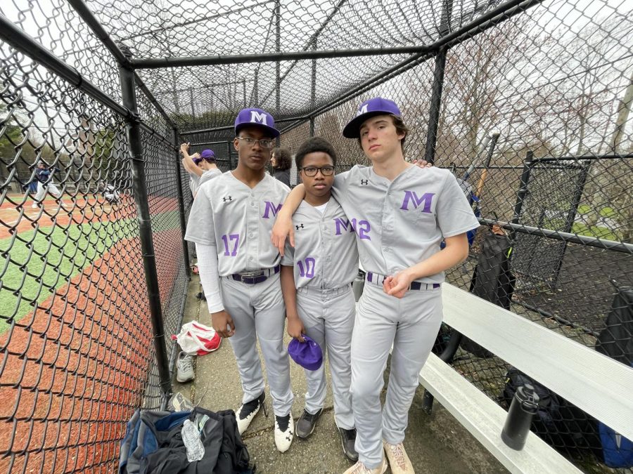 Varsity players Zahali, Jeren Staber, and Leo Horton pause for a dugout picture. Masters played Rye Country Day and lost 7-3 on April 6.