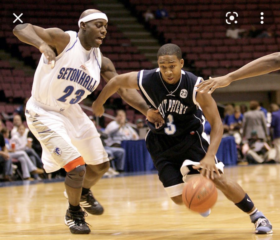 Masters Varsity Basketball Coach and St. Peters alum Keydren Clarke driving down the lane
against a Seton Hall. Clarke averaged 25.9 points for four seasons for St. Peter’s from 2002-2006.