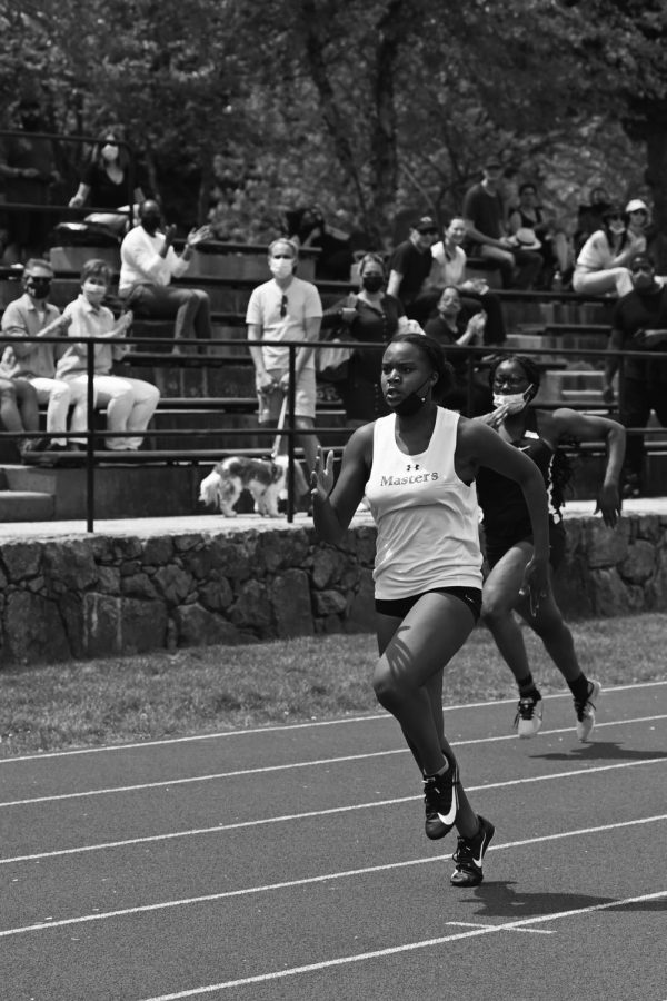 Senior Camille Smith runs in a track meet at Greene Family Field. Smith broke her own school record in the 10 meter dash as well as a five year school record held by Alice Kinsley in the 200 meter dash in a meet at Hackley on April 12. 