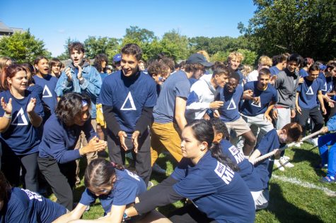 Adul Samon, Ian Stein, and Marco Ferrando are among many Delta seniors encouraging middle schoolers in tug of war