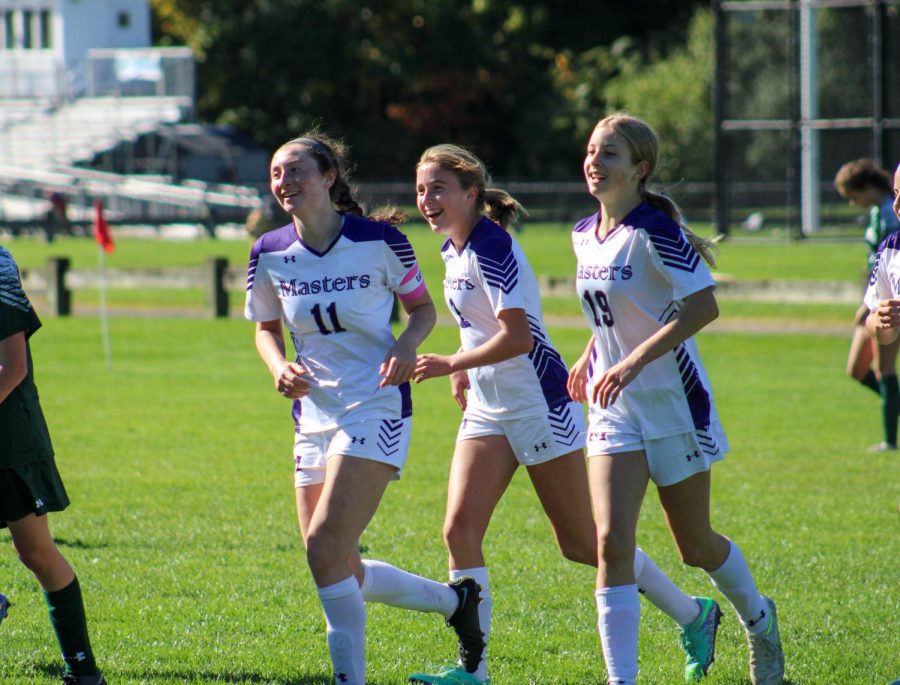 Sophomore Anna Moscato, freshman Clio Foley and senior Hannah Schapiro celebrating during their away game against Greenwich Country Day School on October 7th. For senior Schapiro this is her last season with the Panthers. She committed to the University of Maryland to play soccer.
