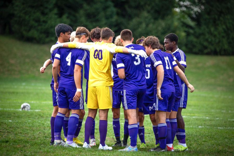 THE+BOYS+SOCCER+TEAM+gathers+for+a+pre-game+huddle.+Led+by+senior+captains+Adul+Samon+and+centerback+David+Ferrando%2C+the+team+has+put+together+their+second+consecutive+double+digit+win+season%2C+entering+playoffs+with+a+11-2-2+record.+The+team+has+gone+undefeated+against+NYSAIS+opponents+but+unfortunately+lost+their+last+FAA+regular+season+game%E2%80%94+falling+to+fifth+place.+The+team+will+travel+Monday%2C+November+7+for+the+quarterfinal+game.