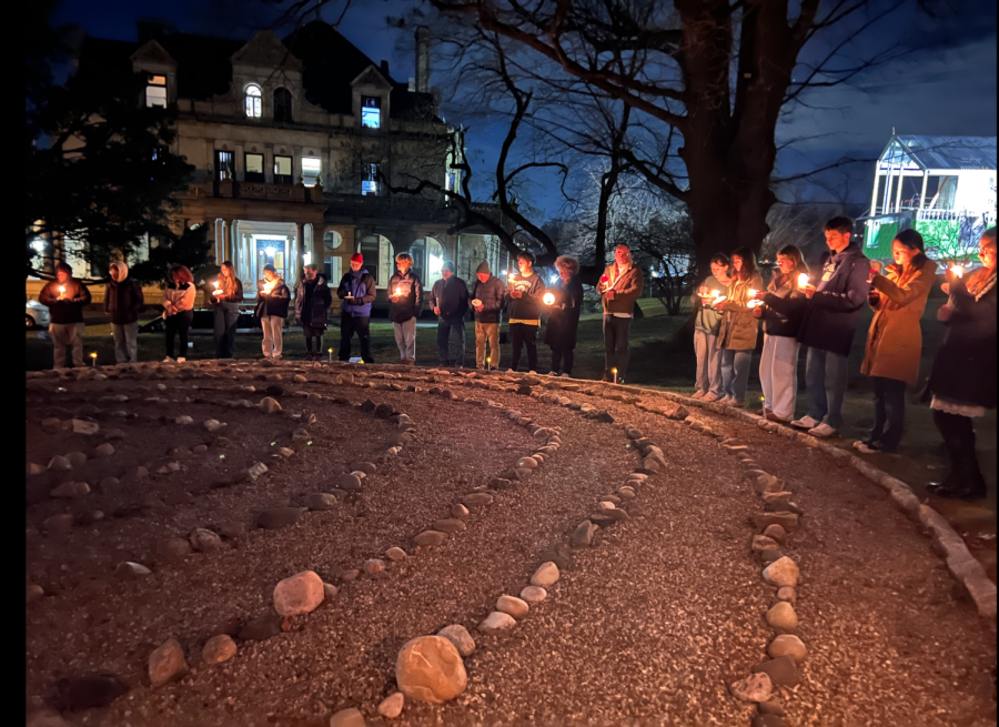 Students+and+faculty+gather+at+the+labyrinth+by+Estherwood+to+exchange+words+of+sorrow.