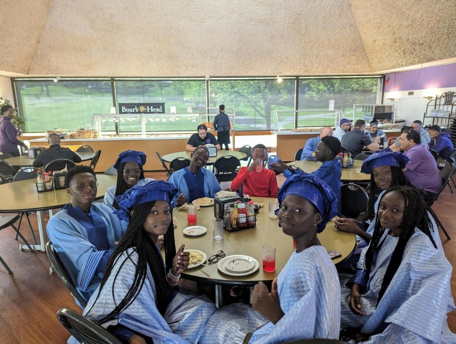 Students on an exchange trip from Senegal sitting in the Masters Dining Hall.