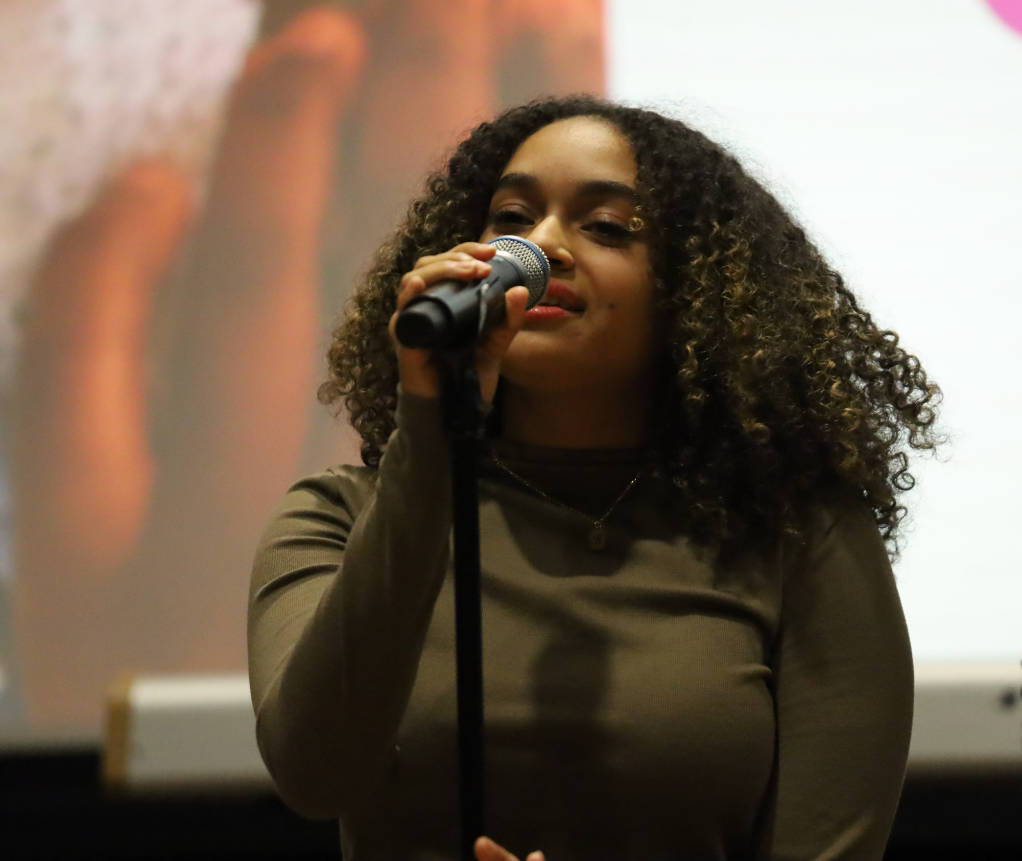 Senior Keira Burgos hold the mic as she performs When I Was Your Man by Bruno Mars. Burgos has been an active members in arts around Masters participating in Dance Company and Masters Mainstage.