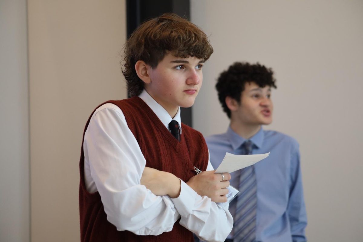Sebby Simkin 26 (front) and Jesse Gelman 25 (back) worked in the backroom for the tri-committee crisis. The groups, JCC: China, JCC: USA and JCC: Russia were comprised of delegates at the high school level. 