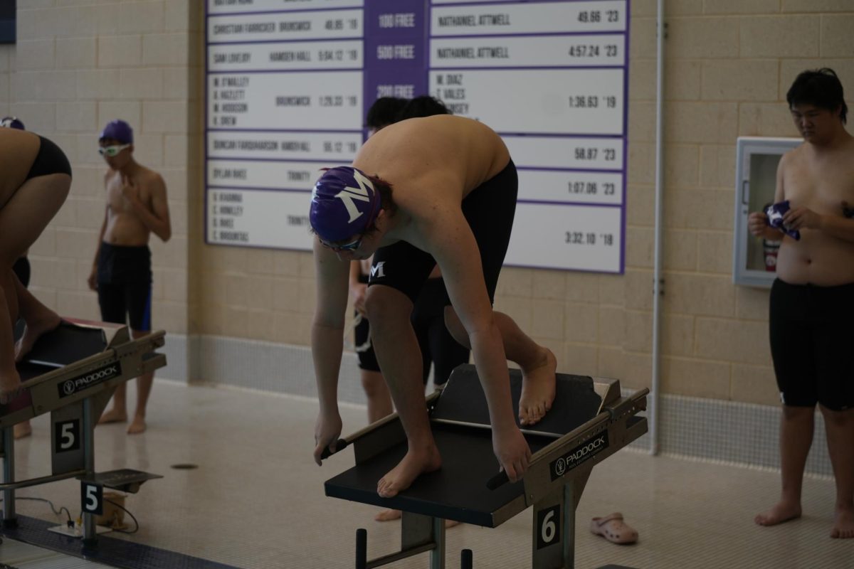 A+student+dives+into+Masters+swimming+pool+in+the+teams+first+home+meet+of+the+winter+season.