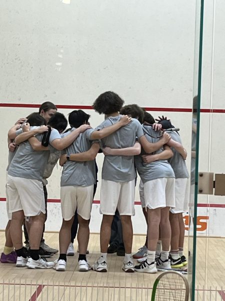 After introductions, the team did a group huddle before their matches.