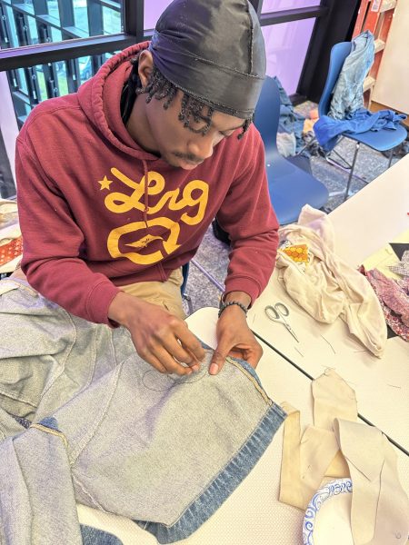 Jonathan Mafuru was in the “#Memadeit” WinterMission. He was able to upcycle his own clothing and thrifted clothing by learning how to sew.