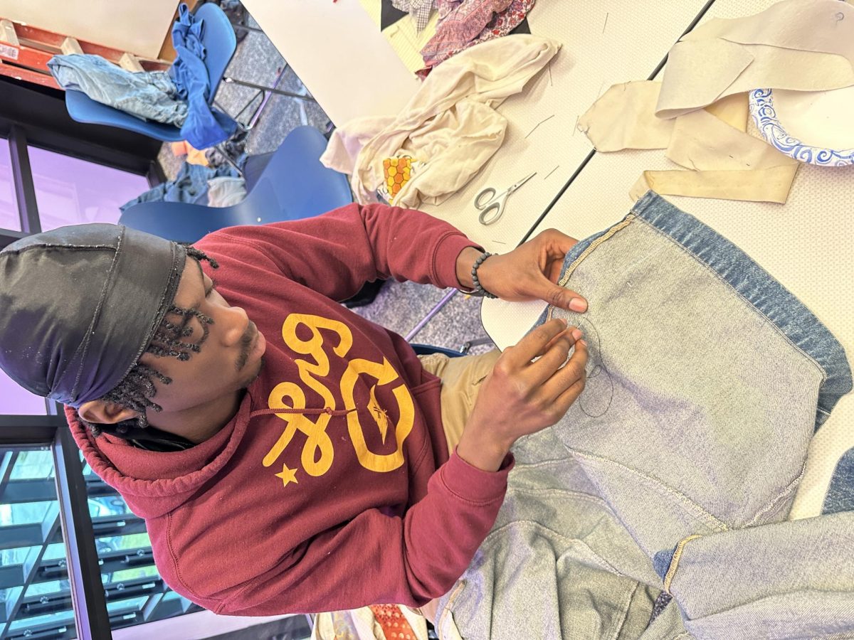 Jonathan Mafuru was in the #Memadeit Intermission. He and other students learned how to upcycle their own and thrifted pieces of clothing by sewing and hemming them.