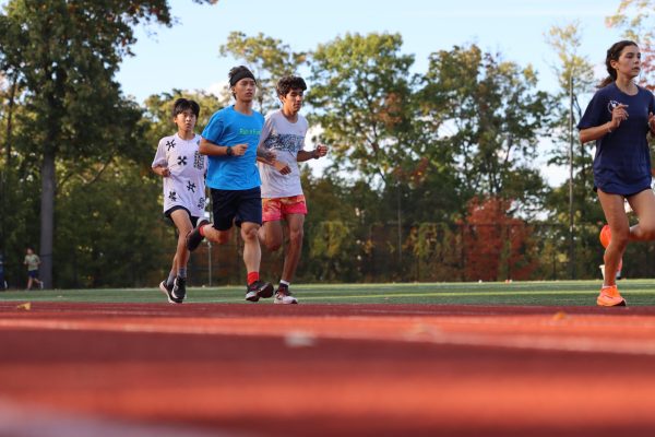 Captain Jamie Milward runs with Jose Meister '26 and Tozai Kawabata '25 during a workout. Milward plans on leading the team to even more success than last year.