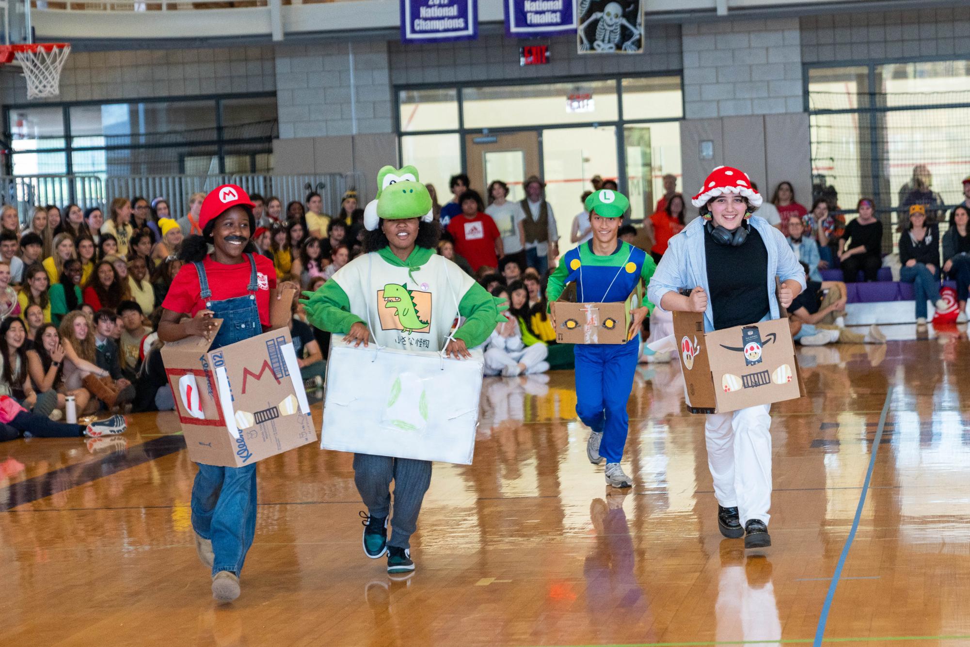 Juniors M’kaela Riley, Anastacia Alexander, Jamie Milward and Ross Manzano race around obstacles in a Mario Kart-themed skit. The students dressed as the video game characters Mario, Yoshi, Luigi and Toad. The Halloween assembly started just before 2 p.m. and ended at around 3:40 p.m.