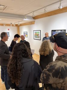 One formerly incarcerated individual and member of RTA, Hector "Bori" Rodriguez, explains the significance of his artwork to a group of people at the Windows and Doors exhibit open until Jan. 2, 2025. 