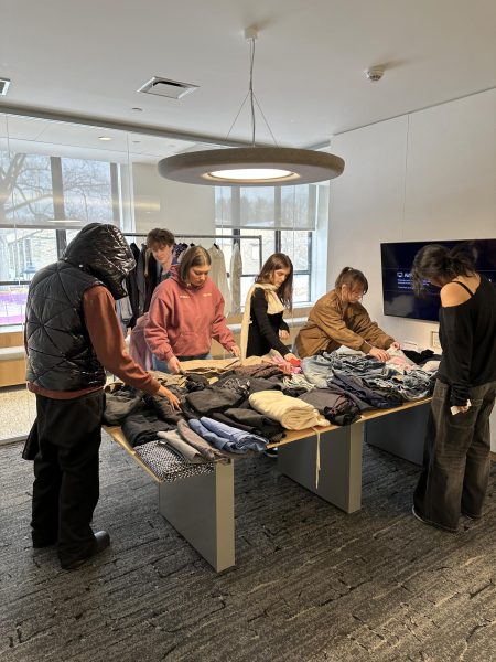 Students look through donated clothes to repurpose in the WinterMission “#MeMade@Masters” led by Ellen Cowhey, Allison Eggleston, Penny Peng and Ilona Shinkar.