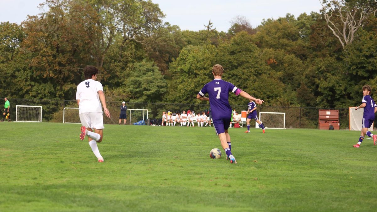 Alan Eskenazi' 26 dribbles past RCDS in Varsity Boy's Soccer game on Clark Field. Thje match took place on October 7th and ended in a 1-2 loss.
