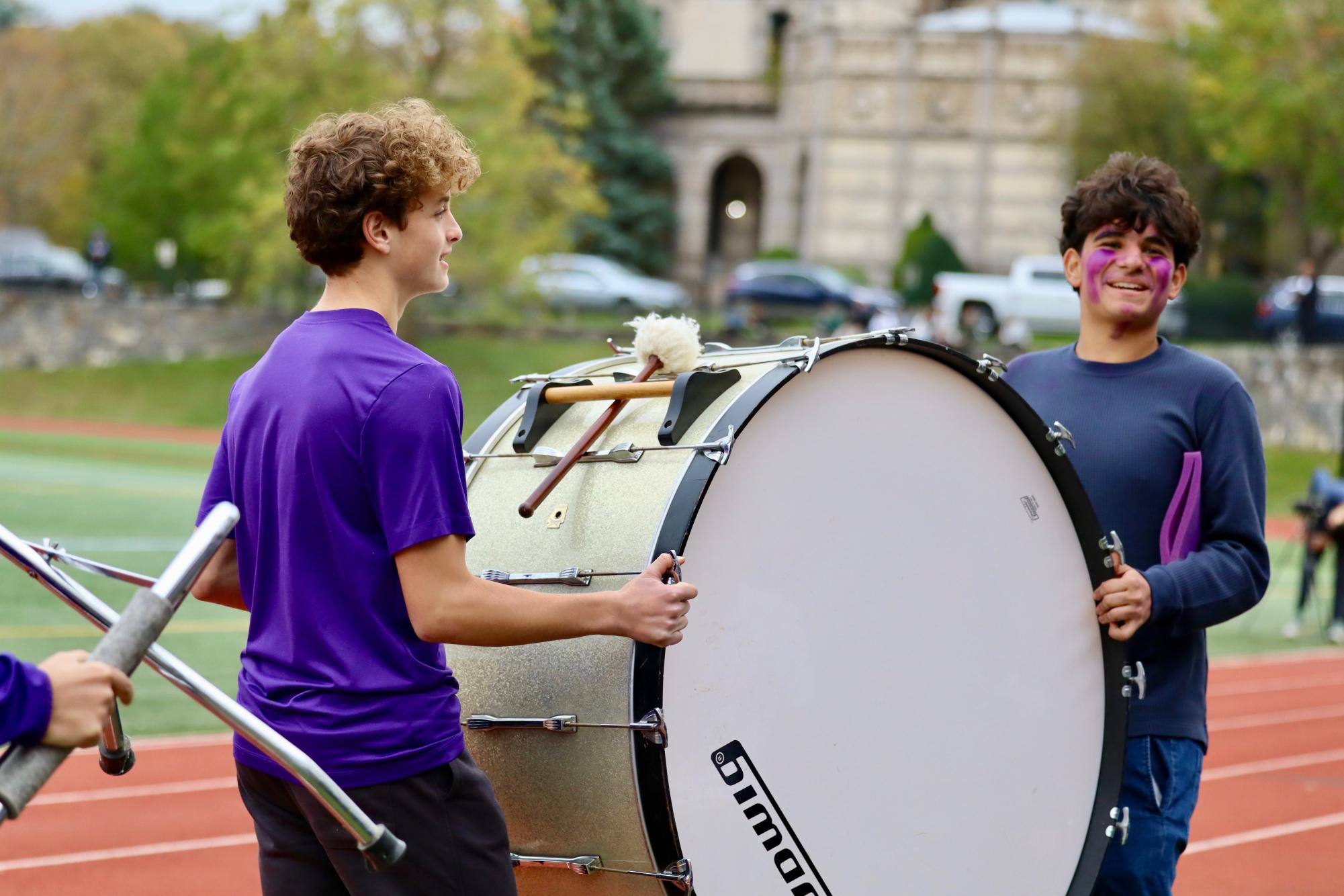 Senior Max Lichtman and sophomore Garrett Navin cheer on the girls varsity
soccer team during their Fairchester Athletic Association quarter finals game on Nov. 3. Since Masters does not have cheerleaders, the two decided to substitute flips and chants with the beat of a drum.
