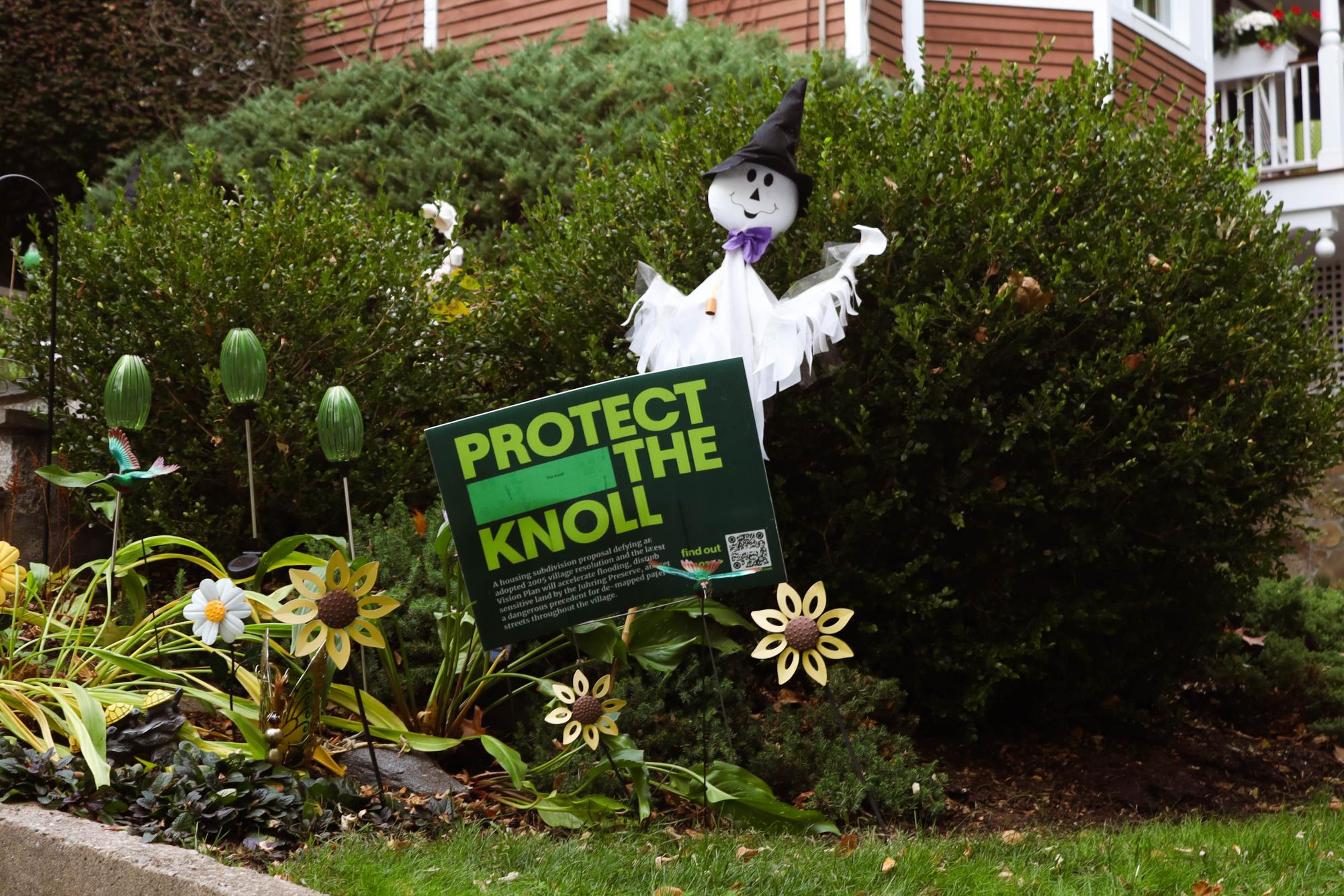 Signs fill the streets neighboring The Knoll. The developer’s proposal threatened to deforest several lots of land to construct single-family homes. To build these homes, the developer would need to clear over 100 trees and install a stormwater retention system to prevent excessive flooding in the neighborhood.