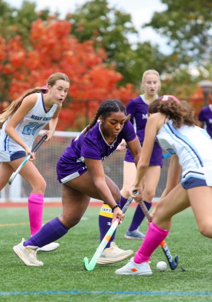 Senior defender Willow Lovett blocks the ball from a player of the School of Holy Child. With the hard work she put in, Lovett helps the team secure an early head start and eventually an incredible 6-1 victory. 
