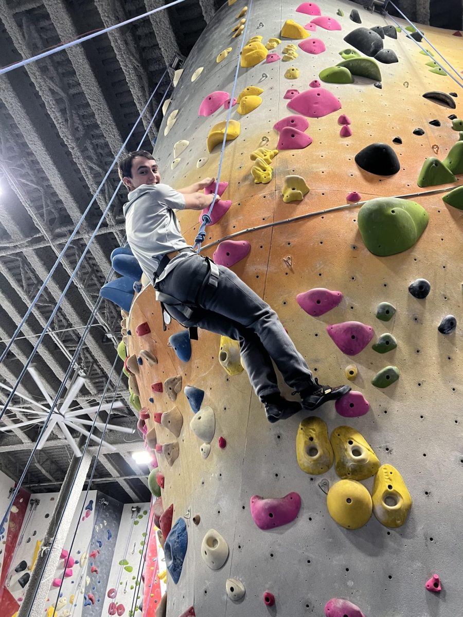  A student climbs an indoor rock wall during Winter Mission, a four-day program that allows students to step away from academic pressure and explore hands-on experiences. The calm, neutral tones of the space mirror the reflective break Winter Mission provides between semesters.