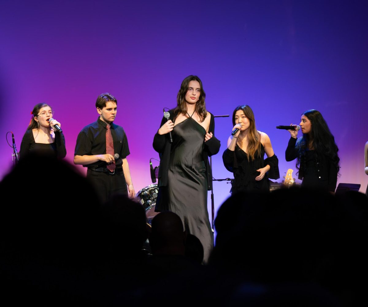 Ash Munitz '27 stands with Dobbs 16 as she solos Twilight Zone by Ariana
Grande. The Winterlight concert on Sunday, Dec. 14. featured music performed by several DoPA classes, and took place in the new Strayer Theater in Follett Hall. Later this winter, DoPA will put on the Upper School Revue and the Upper School Musical.