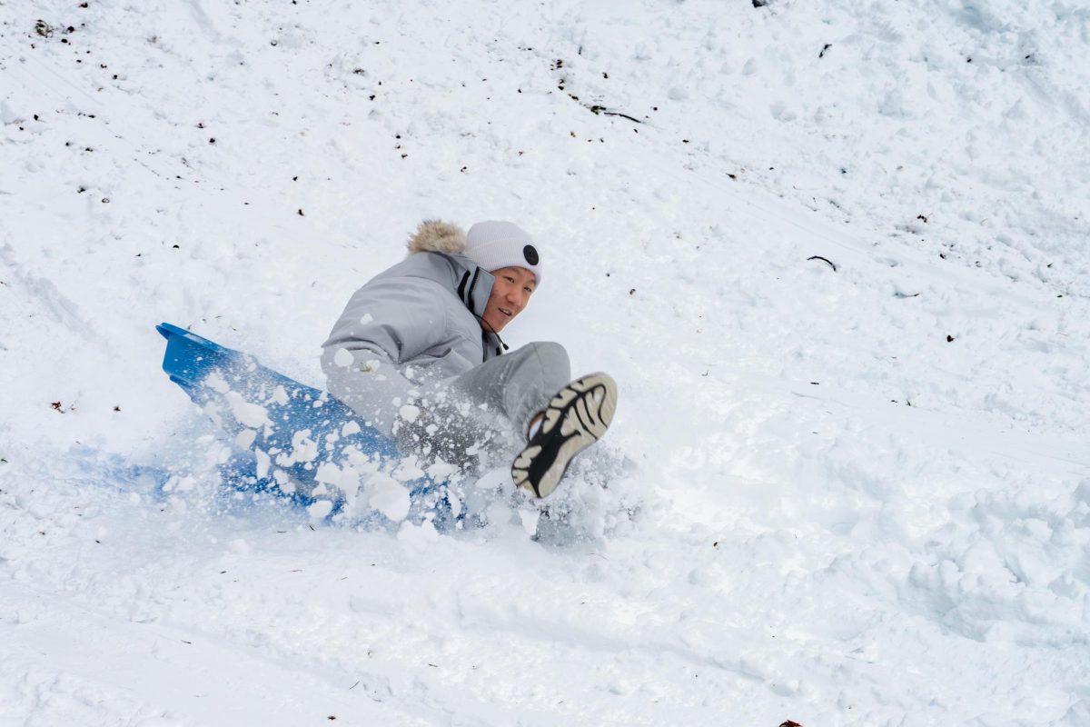 Andrew Cheng '29 sledding outside of the hill dorms for the first time as a Masters student. Over the weekend,
Dobbs Ferry received the first major snowfall of the year, with 4 to 5 inches of snow on the ground. Seizing the opportunity, boarders joined together and sledded down the hill for hours.