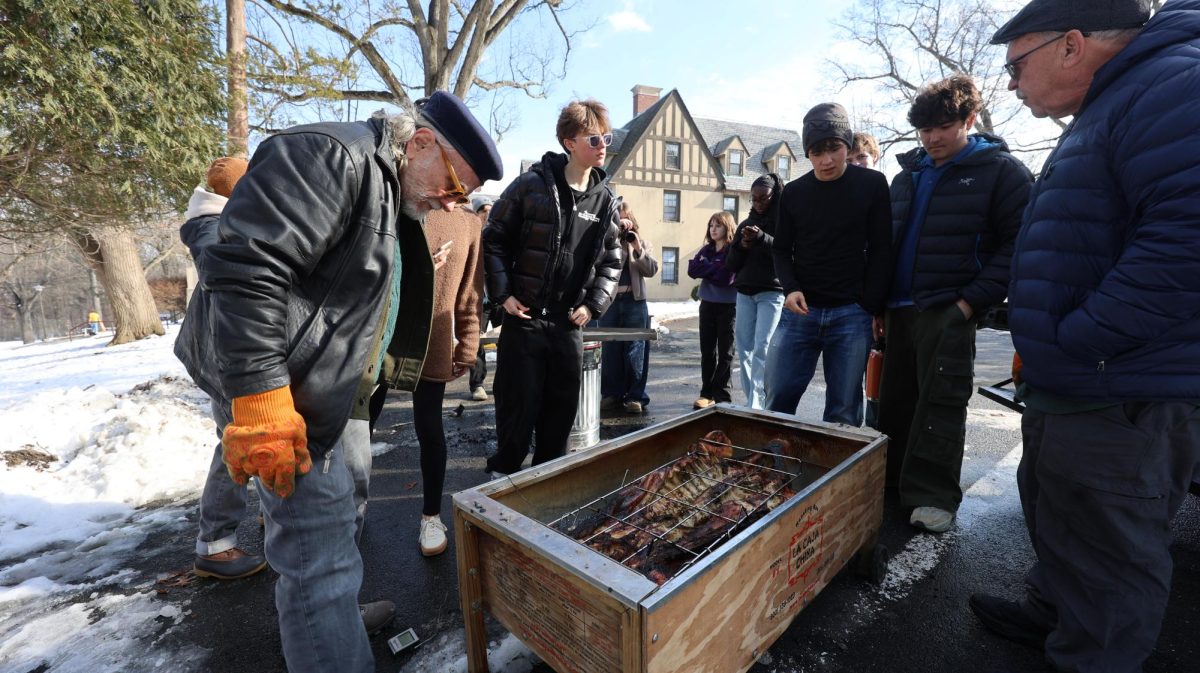 Students in the "The Art of the Feast: Cooking, Hosting and Connection" WinterMission look at their central piece of their traditional Puerto Rican roast, a pig. This WinterMission was dedicated to preparing this large meal over the course of four days. On the last day, the feast was held in a hill dorm dining room, and the students and faculty of the course connected through their hard work.