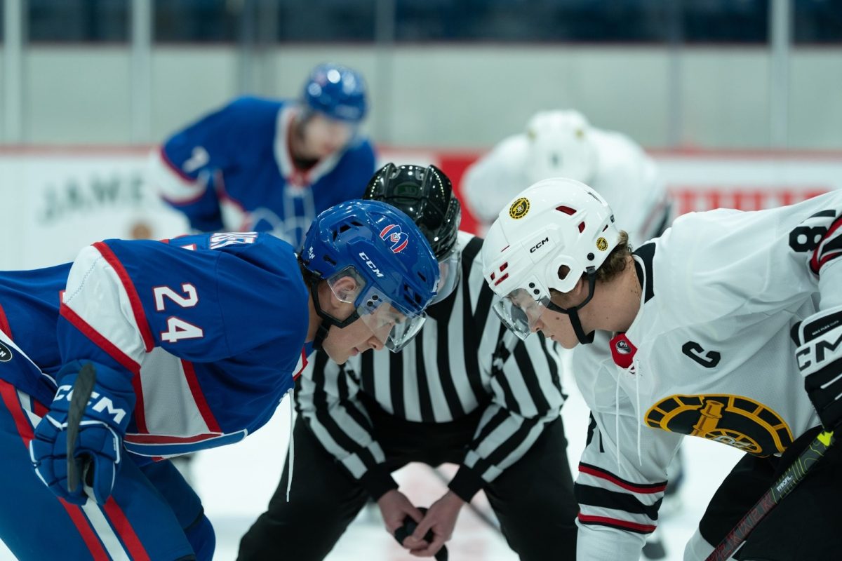 Hudson Williams (left) and Connor Storie (right) face off in "Heated Rivalry," a Canadian TV series based on the novel by Rachel Reid. The show, a new cult-favorite, follows the secret fling between two major-league hockey stars.