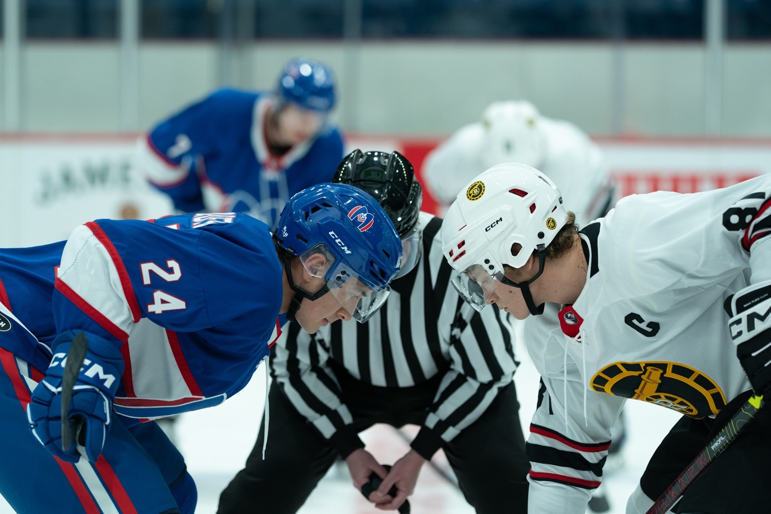 Hudson Williams (left) and Connor Storie (right) face off in "Heated Rivalry," a Canadian TV series based on the novel by Rachel Reid. The show, a new cult-favorite, follows the secret fling between two major-league hockey stars.