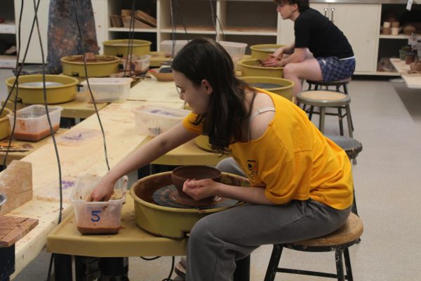 Bella Danahy-Levine '26 throws a bowl on the pottery wheel in the ceramics studio. Danahy-Levine, Bennet Sonnenberg '26 and Caitlin Berry '28 are spearheading the event under the guidance of Upper School Visual Art Teacher Stephanie Mestyan. The Empty Bowls team will sell bowls on May 1, and the proceeds will go to Feeding Westchester.