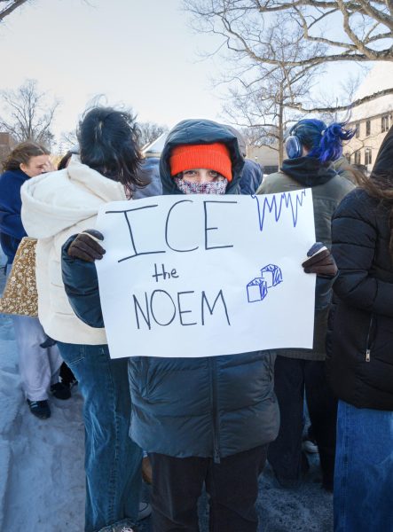 A Masters Student walks out on National Shutdown Day on Jan. 30. Chanting and holding signs, students protested against the Department of Homeland Security's violent actions. Across the ocean, youth protests in Iran attempted to hold the Iranian government accountable.