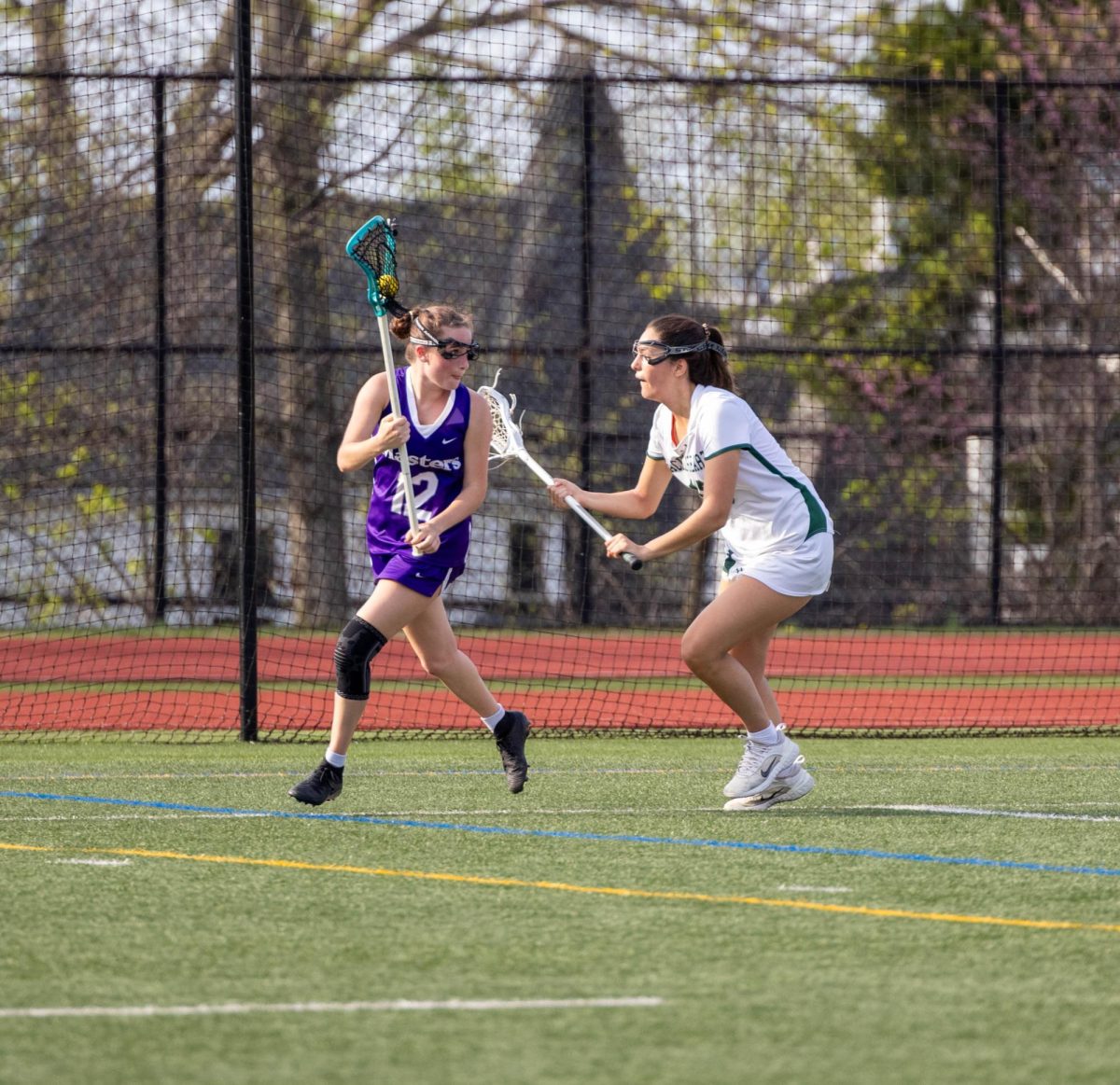Bella Henriquez ‘26 cradles the ball against Sacred Heart Greenwich on April 15. This was the fourth game of the season, with a lot of pressure placed on it because of Sacred Heart Greenwich’s reputation of lacrosse success. The team won in overtime, 11-10, contributing to the
team’s end-of-season record of 10-3.