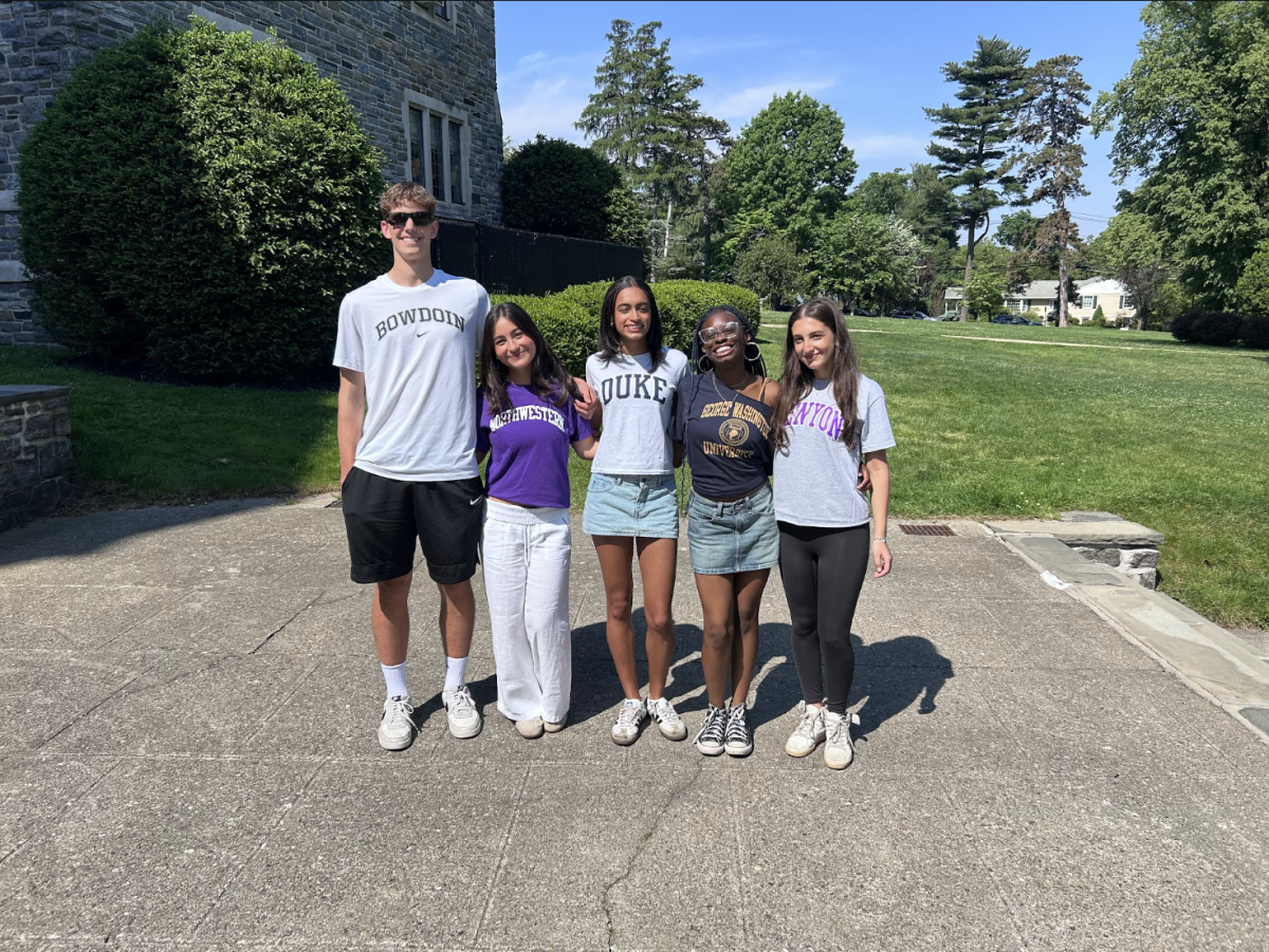 Tower Press seniors stand on Graduation Terrace in their college t-shirts. From left to right: Thomas McCallum, Allie Faber, Neena Atkins, Ayanna Beckett and Mila Benson. 