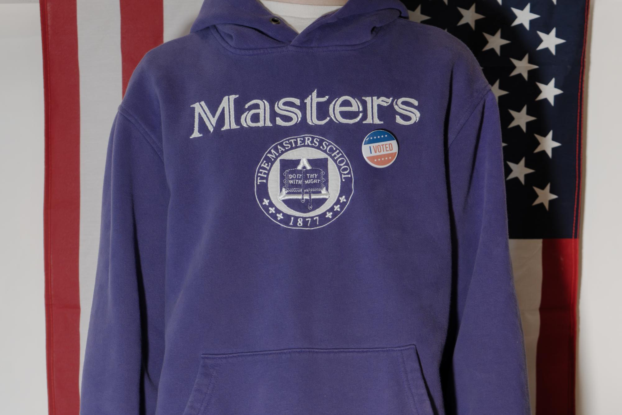 The Masters themed sweater dawns an "I Voted Sticker," signifiying The Masters' distinct political views.